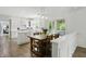 Eat-in kitchen with custom white cabinets, stainless appliances and view of outdoor seating area at 5419 Cayman Dr, Carmel, IN 46033