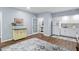 Bright kitchenette features white cabinets, wood floors, and views to other rooms at 5419 Cayman Dr, Carmel, IN 46033
