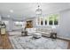 Spacious basement features living area with kitchenette, hardwood flooring, and ample natural light at 5419 Cayman Dr, Carmel, IN 46033