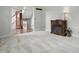 Inviting living room featuring a decorative fireplace and view of entry and staircase at 5419 Cayman Dr, Carmel, IN 46033