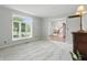 Bright living room featuring neutral walls and carpeting, plus a view of exterior and entry at 5419 Cayman Dr, Carmel, IN 46033