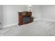 Cozy living room featuring a decorative fireplace, plush carpeting, and neutral wall paint at 5419 Cayman Dr, Carmel, IN 46033