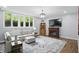 Finished basement offers hardwood flooring, an electric fireplace, and ample natural light at 5419 Cayman Dr, Carmel, IN 46033