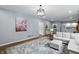 Finished basement boasts living area with kitchenette, wood floors, and plenty of room at 5419 Cayman Dr, Carmel, IN 46033