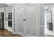 A pantry with a double door and a view into the kitchen and laundry area at 5419 Cayman Dr, Carmel, IN 46033