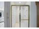 Shower with glass block wall and gold trim at 5419 Cayman Dr, Carmel, IN 46033