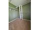 Walk-in closet with carpet flooring and built-in shelving at 5515 Lunsford Dr, Indianapolis, IN 46237