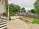 Wooden deck overlooking a well-maintained yard, complete with benches, a grill and outdoor seating at 5542 N Olivia Dr, Alexandria, IN 46001