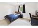 Bedroom with carpet flooring, ceiling fan, black-out curtains, and a desk and chair at 5542 N Olivia Dr, Alexandria, IN 46001