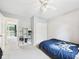 Cozy bedroom featuring plush carpet, neutral paint, and ceiling fan with access to an outdoor deck area at 5542 N Olivia Dr, Alexandria, IN 46001