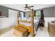 Comfortable bedroom with a four-poster bed, neutral walls, and wood accents at 5542 N Olivia Dr, Alexandria, IN 46001