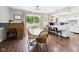 Bright and airy dining area with hardwood floors, sliding glass doors, and views of the backyard at 5542 N Olivia Dr, Alexandria, IN 46001