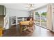 Lovely dining area features hardwood floors, natural light, and seamless access to the outdoor deck at 5542 N Olivia Dr, Alexandria, IN 46001