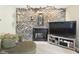 Inviting living space showcasing a brick fireplace with decor, complemented by modern entertainment setup at 5542 N Olivia Dr, Alexandria, IN 46001
