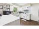 Well-lit kitchen features white cabinets, a microwave, and natural light from a window at 5542 N Olivia Dr, Alexandria, IN 46001