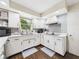 Clean kitchen with white cabinets, matching appliances, and tiled floors at 5542 N Olivia Dr, Alexandria, IN 46001