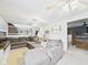 Comfortable living room with a large sofa, access to the dining room and stairs at 5542 N Olivia Dr, Alexandria, IN 46001