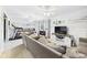 Cozy living room with plush sofa, TV, and ample natural light from the windows at 5542 N Olivia Dr, Alexandria, IN 46001
