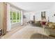 Bright living room with large windows, plush seating, and a view of the staircase at 5542 N Olivia Dr, Alexandria, IN 46001