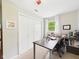 Comfortable office area with desk, chair, shelves, and windows at 5542 N Olivia Dr, Alexandria, IN 46001