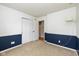 Bedroom with neutral carpet, baseboard detail, and white walls at 560 Tracy Ln, Brownsburg, IN 46112