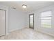 Versatile room with neutral walls and tile floors, ideal as a bedroom or office, featuring a door to the patio at 560 Tracy Ln, Brownsburg, IN 46112