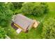 Aerial view featuring a home with a deck surrounded by lush trees, providing a sense of privacy at 5730 S 50 W, Trafalgar, IN 46181