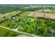 Aerial view of a property with pond and lush greenery, the perimeter is outlined by property lines at 5730 S 50 W, Trafalgar, IN 46181