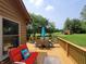 View of the back deck with outdoor seating and an umbrella at 5730 S 50 W, Trafalgar, IN 46181