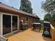 View of the home's back deck with an outdoor cooking setup at 5730 S 50 W, Trafalgar, IN 46181