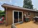 View of the home's back deck with a sliding glass door and grill at 5730 S 50 W, Trafalgar, IN 46181