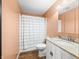 Updated bathroom with granite countertop, updated fixtures, shower-tub combo, and laminate flooring at 5730 S 50 W, Trafalgar, IN 46181