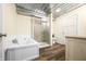 Bright bathroom features shower, soaking tub, metal ceiling, and wood-look floors at 5730 S 50 W, Trafalgar, IN 46181