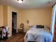 Cozy bedroom featuring a floral-patterned bedspread and hardwood floors at 5730 S 50 W, Trafalgar, IN 46181