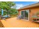 This wooden deck has an outdoor dining area and offers a space for relaxation and entertaining at 5730 S 50 W, Trafalgar, IN 46181
