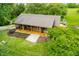 Charming home featuring a covered front porch with ample seating and a well-manicured front yard at 5730 S 50 W, Trafalgar, IN 46181