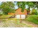 Detached two car garage on hillside property with wooded surroundings at 5730 S 50 W, Trafalgar, IN 46181