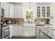 Well-appointed kitchen boasting granite countertops, a farmhouse sink, and modern appliances at 5730 S 50 W, Trafalgar, IN 46181
