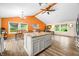 Open kitchen and dining area featuring a central island, hardwood floors, and contemporary finishes at 5730 S 50 W, Trafalgar, IN 46181
