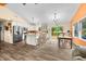 Modern kitchen and dining area showcasing stainless steel appliances, a kitchen island, and backyard views at 5730 S 50 W, Trafalgar, IN 46181