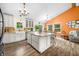 Contemporary kitchen featuring a large island, white cabinetry, and a view of the living area at 5730 S 50 W, Trafalgar, IN 46181