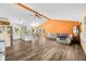 Open-concept living room with a kitchen island, hardwood floors, and vaulted ceilings at 5730 S 50 W, Trafalgar, IN 46181