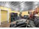 Spacious living room featuring laminate flooring, modern lighting, and comfortable seating at 5730 S 50 W, Trafalgar, IN 46181