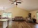 Inviting living space with high ceilings, hardwood floors, and a seamless flow to the kitchen at 5730 S 50 W, Trafalgar, IN 46181