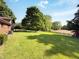Large backyard with a shed, fence and mature trees at 5730 Teresa Dr, Alexandria, IN 46001