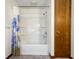 Clean bathroom with a shower/tub combo and blue floral shower curtain at 5730 Teresa Dr, Alexandria, IN 46001