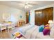 Cozy bedroom featuring a ceiling fan, closet, workspace and decor at 5730 Teresa Dr, Alexandria, IN 46001