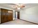 A bright bedroom featuring neutral carpet, a ceiling fan, and closet at 5730 Teresa Dr, Alexandria, IN 46001