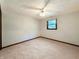 Bedroom featuring neutral carpet, a ceiling fan and a window providing natural light at 5730 Teresa Dr, Alexandria, IN 46001