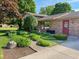 Charming ranch home featuring lush landscaping and a brick pathway at 5730 Teresa Dr, Alexandria, IN 46001
